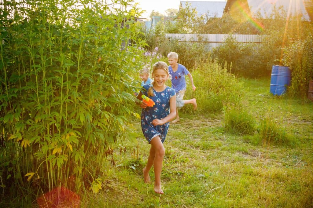children having a water pistol fight