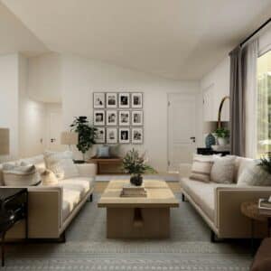 A modern living room with two beige sofas, a wooden coffee table, wall art, indoor plants, and large windows with curtains letting in natural light.