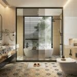 Modern bathroom with patterned tiled floor, freestanding bath, glass shower enclosure, large window with blinds, and a vanity unit with a vessel basin. Slippers are on a mat near the bath.